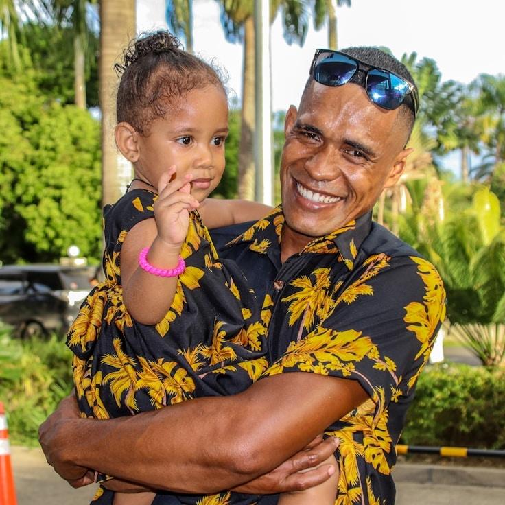 Avery Chen, Lead Design Curator at Field Cabin Harbor, reviewing corporate floral arrangements